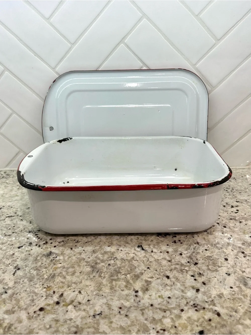 Vintage white enamel pan with red trim